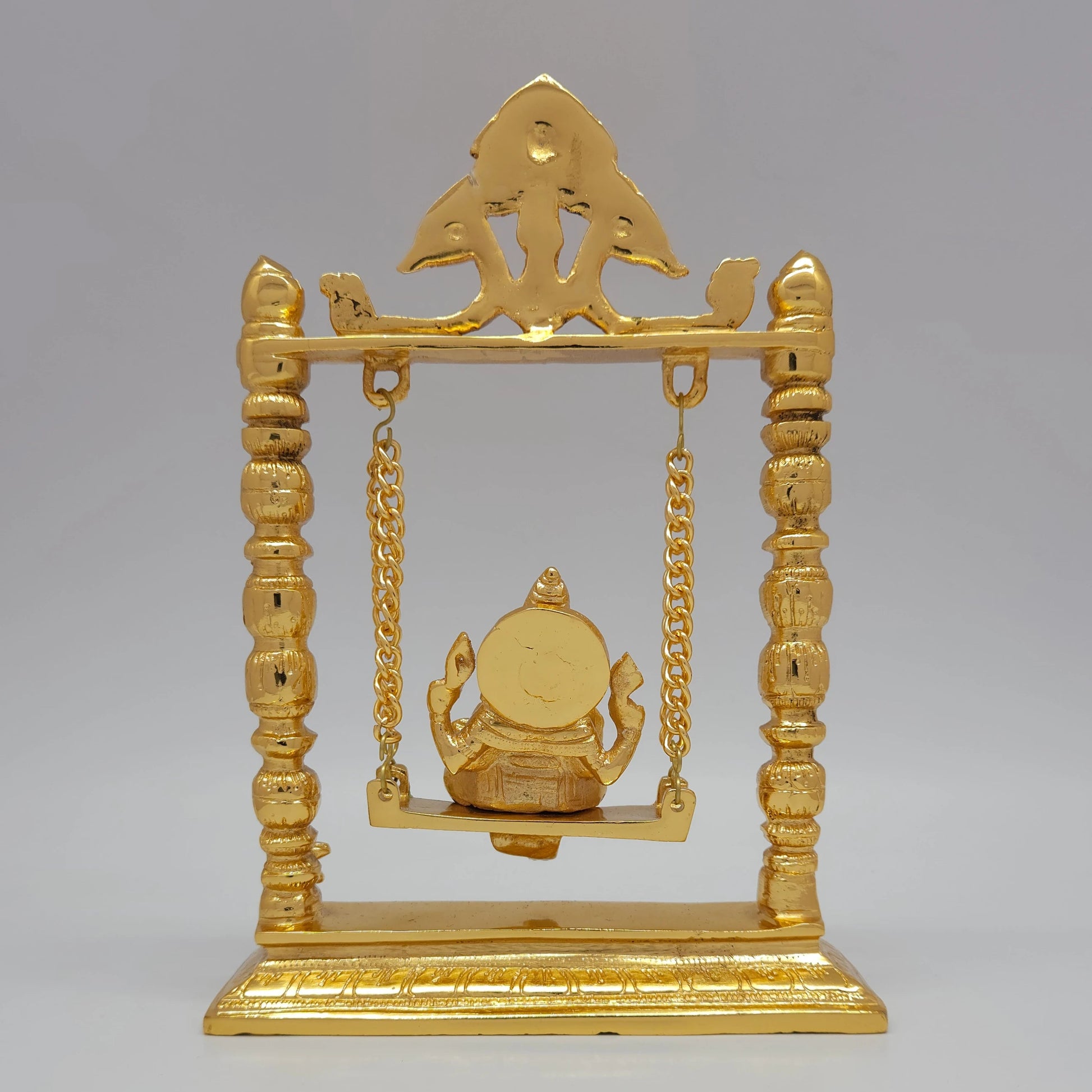 Sri Swaminathan and Co brass Jhula Ganesha swing statue gold finish 25cm height back pose full rear view showing reverse of pillars frame and hanging swing back