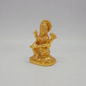 Sri Swaminathan and Co brass miniature Kalaimagal Saraswathi statue gold finish 300g weight 45 degree left pose corner view highlighting the palm leaf scripture hands and side hair details