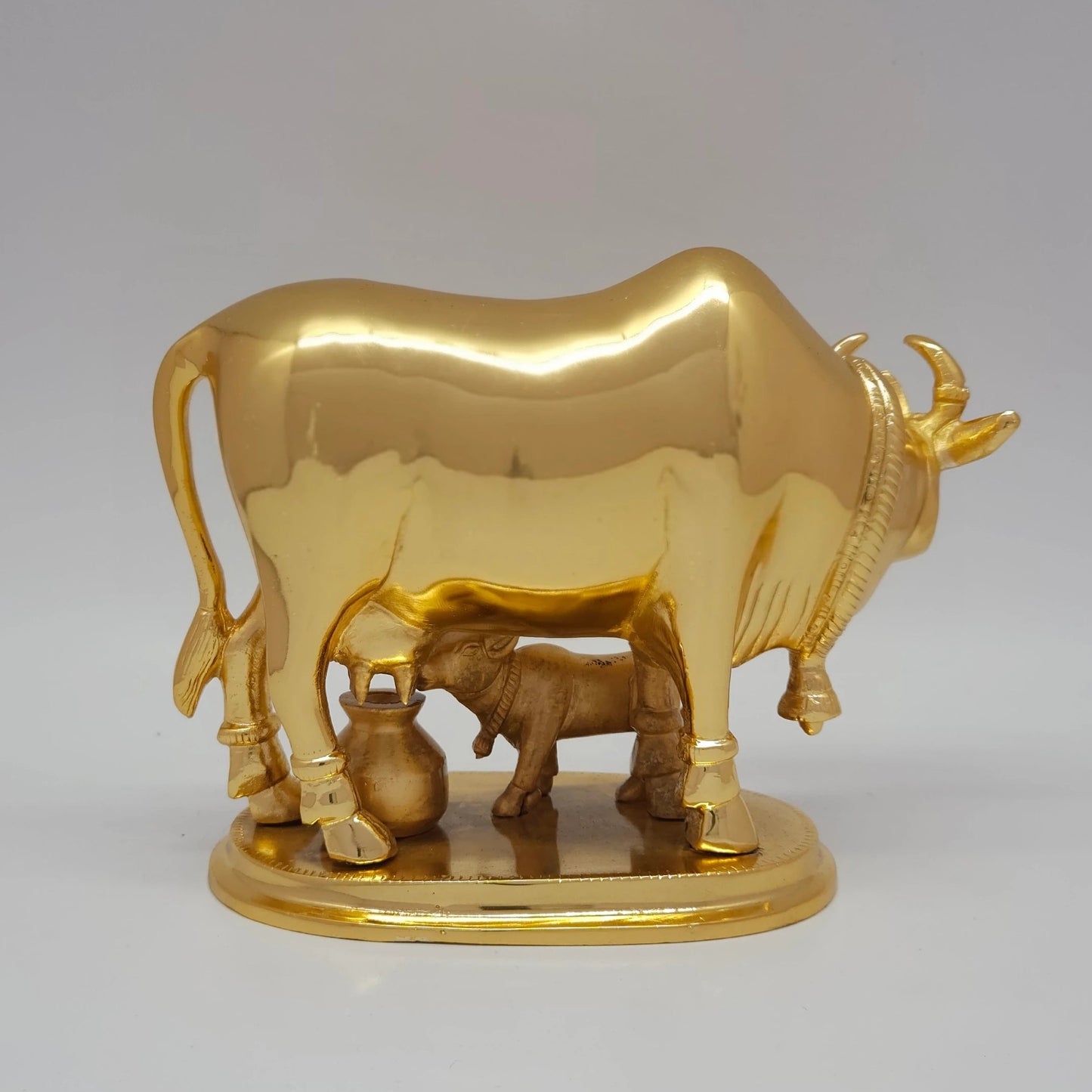 Sri Swaminathan and Co pure brass Kamadhenu cow and calf statue gold powder coated 16cm height back pose full rear view showing reverse of polished tail and back legs