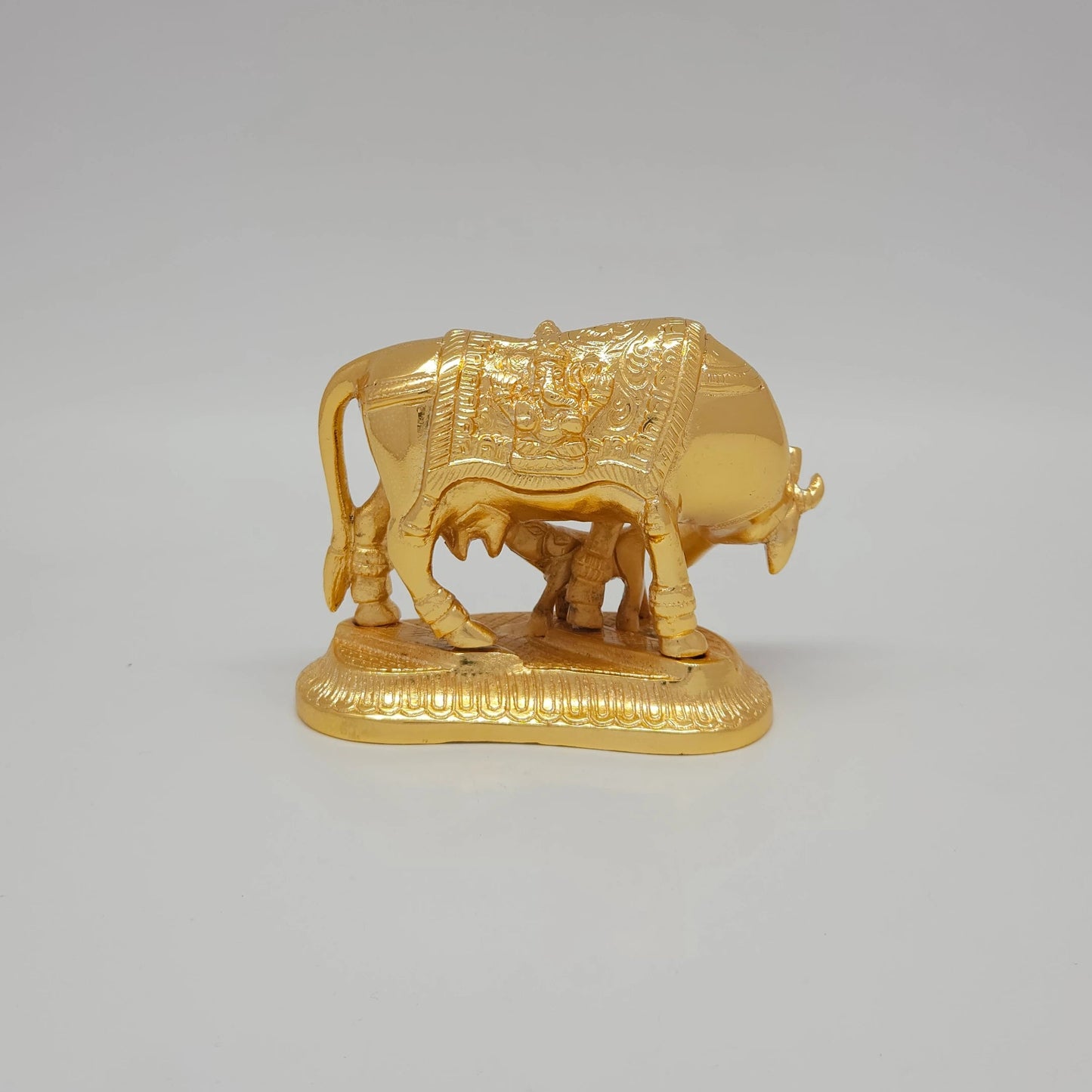 Sri Swaminathan and Co pure brass Kamadhenu cow and calf statue gold powder coated 9cm height back pose full rear view showing reverse of polished tail and back legs