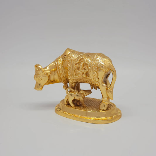 Sri Swaminathan and Co pure brass heavy Kamadhenu cow statue 1kg 45 degree left pose corner view highlighting the machine chiseled neck bell collar and horn details
