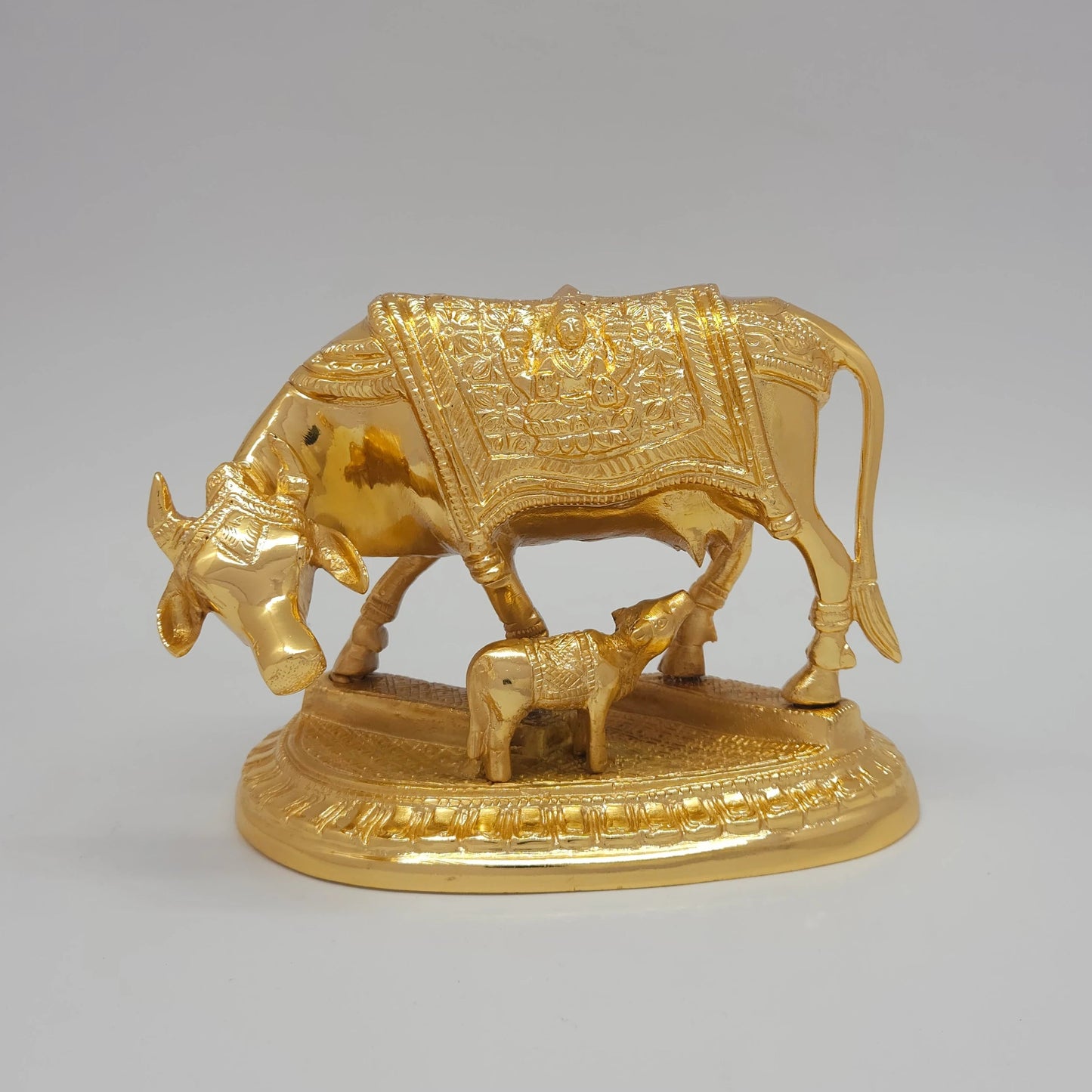 Sri Swaminathan and Co premium pure brass Kamadhenu sacred cow and calf statue Gomaatha Vatsa smooth polished torso gold powder coated finish 2kg weight 16.5cm length front straight view