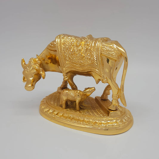 Sri Swaminathan and Co pure brass heavy Kamadhenu cow statue 2kg 45 degree left pose corner view highlighting the chiseled neck bell collar and chain detailing