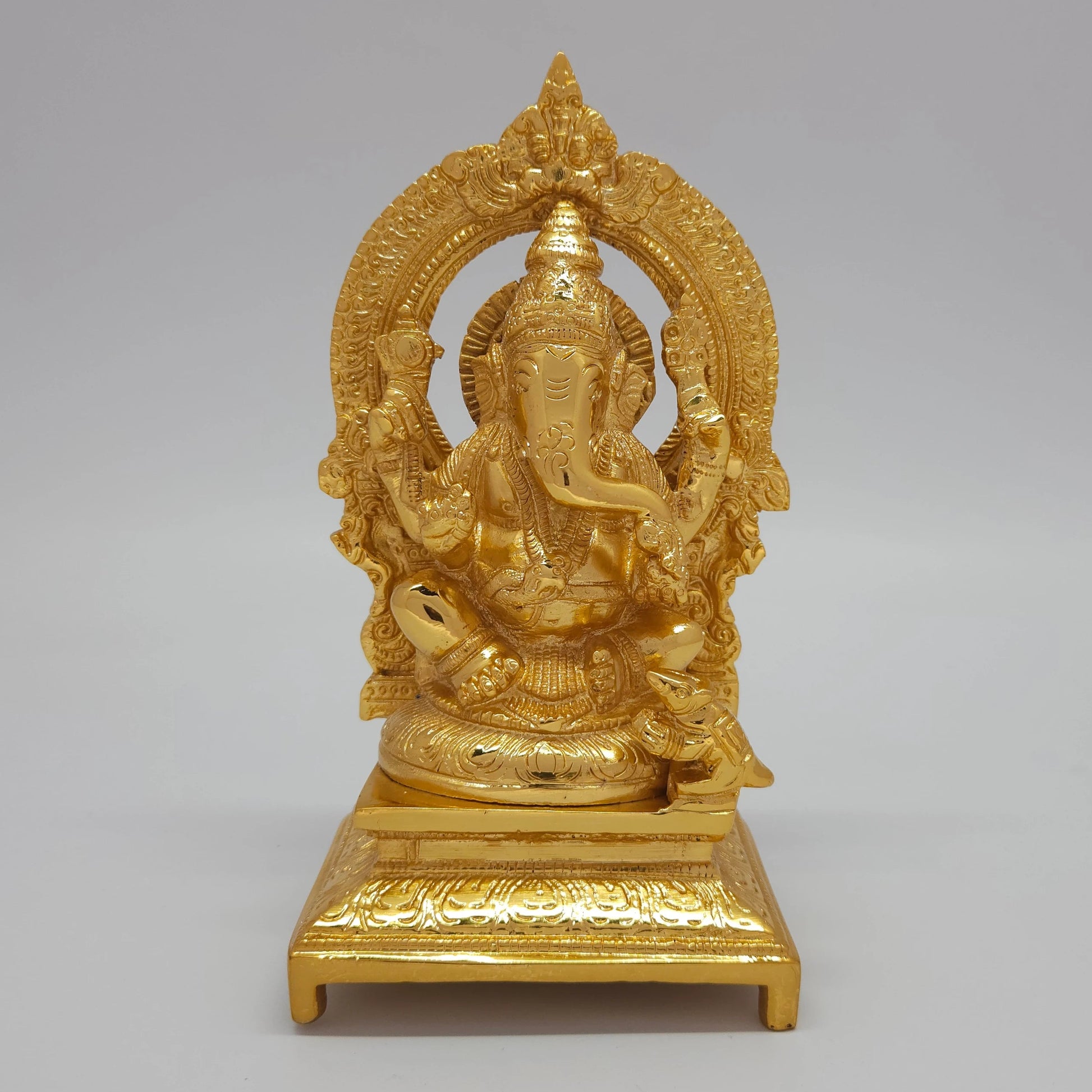 Sri Swaminathan and Co premium brass seated Lalitasana Lord Ganesha statue with temple arch gold powder coated finish 7-inch 19cm height front straight profile view size guide