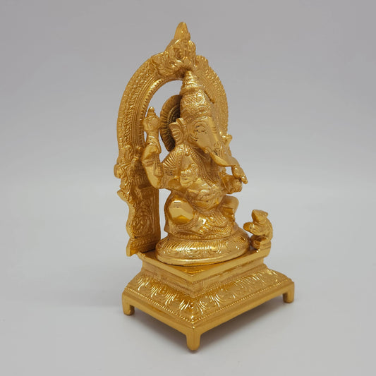Sri Swaminathan and Co brass Ganesha statue with arch gold powder coated 7 inch 19cm height 45 degree right pose corner view focusing on mooshika mouse and base thickness

