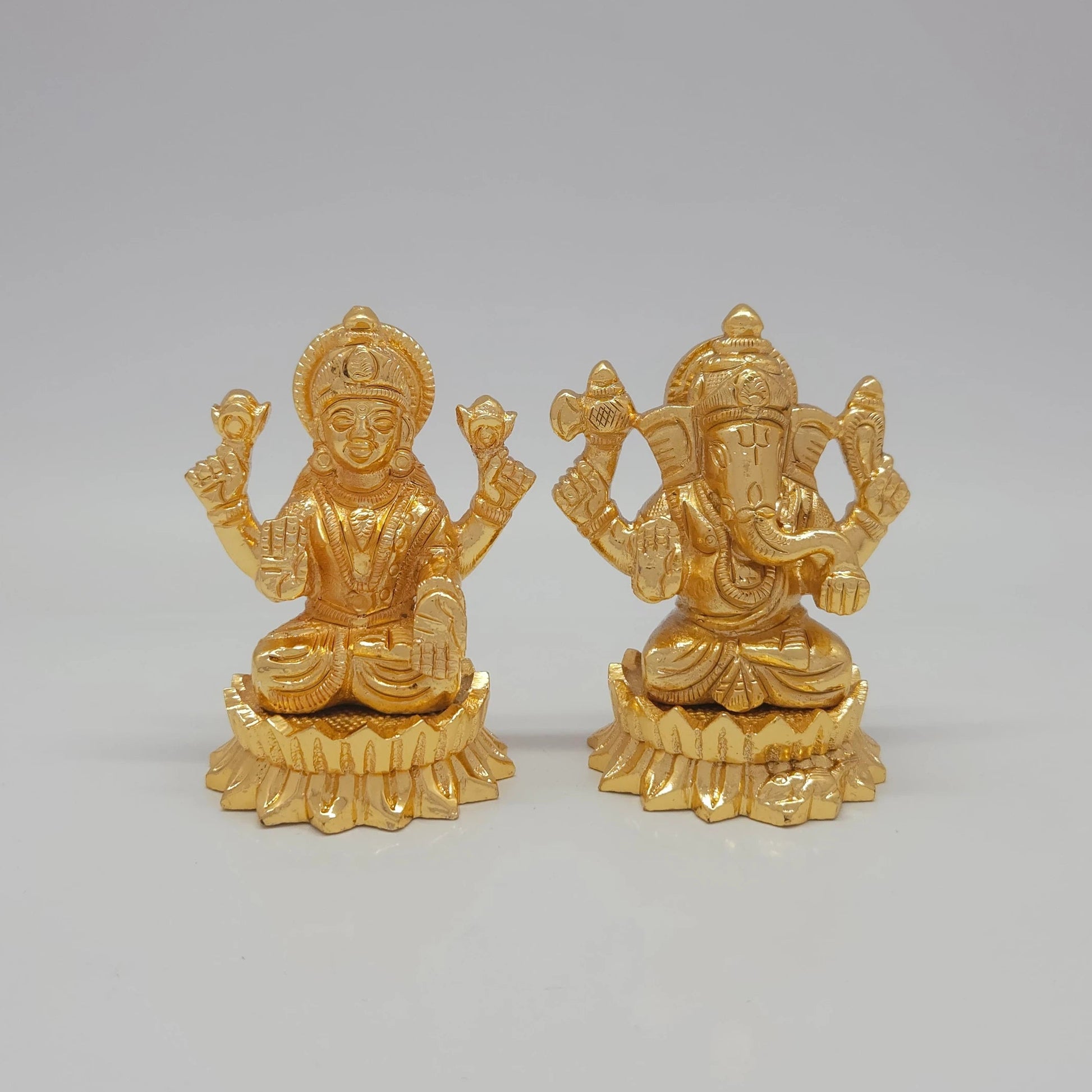 Sri Swaminathan and Co premium brass seated Ganesha and Goddess Mahalakshmi statue twin lotus round base glossy gold finish 200g weight front view