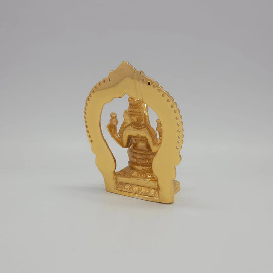 Sri Swaminathan and Co brass miniature Mahalakshmi statue gold finish 250g weight back pose 45-degree rear view showing reverse of flat thiruvatchi temple arch frame and rectangular pedestal