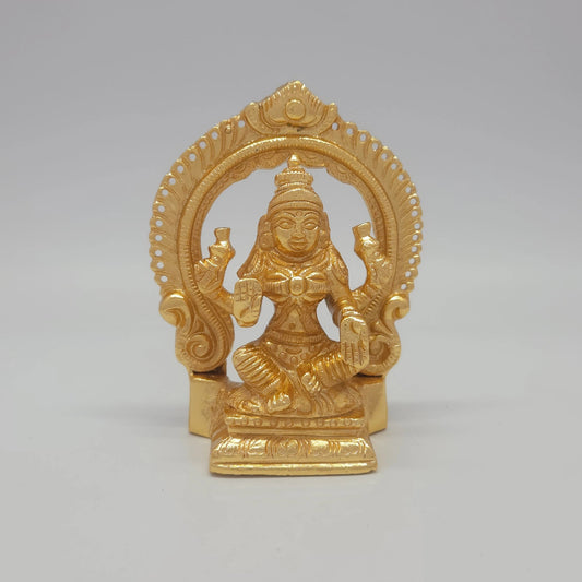 Sri Swaminathan and Co brass miniature Mahalakshmi statue gold finish 250g weight back pose full rear view showing reverse of flat thiruvatchi temple arch frame and rectangular pedestal