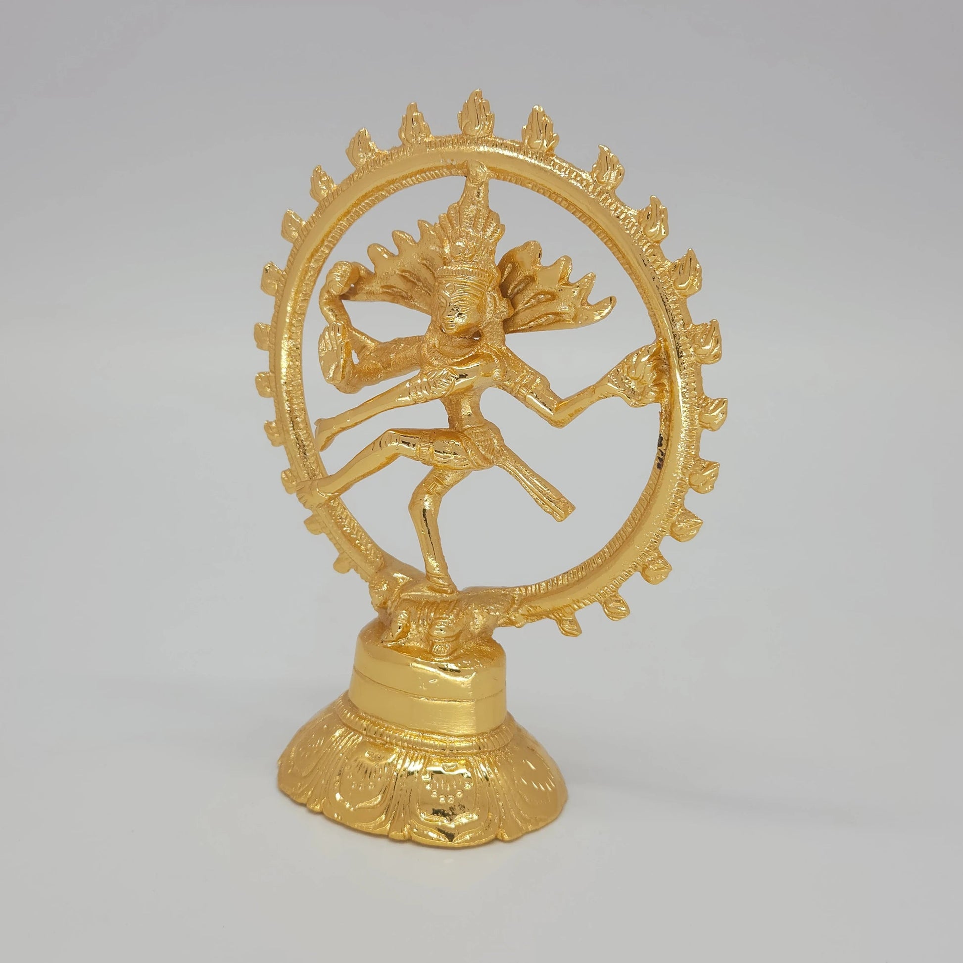Sri Swaminathan and Co brass Lord Nataraja statue gold finish 14cm height 45 degree right pose corner view focusing on agni flame hand and layered lotus base