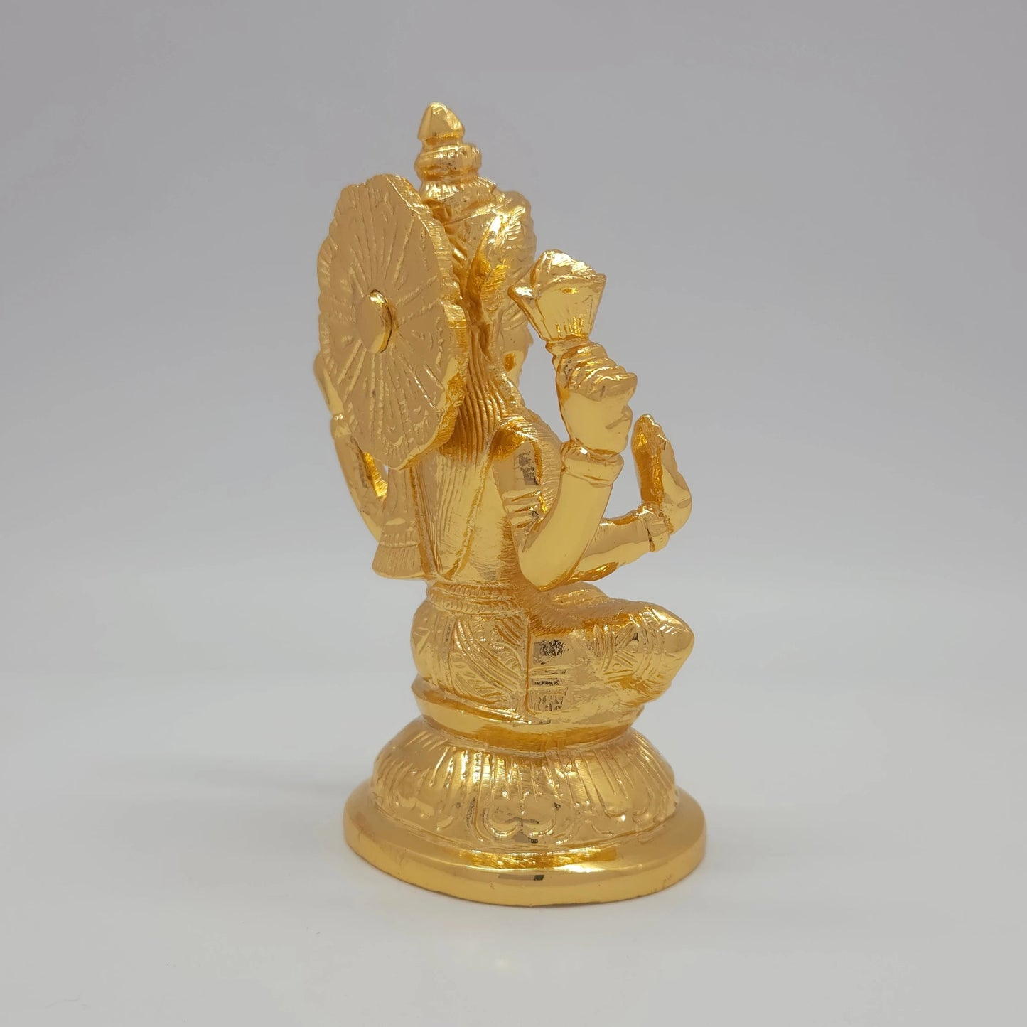 Sri Swaminathan and Co brass Laxmi decor figurine gold finish 750g weight side posture view facing right side rear view showing uniform satin gold powder coated texture layer