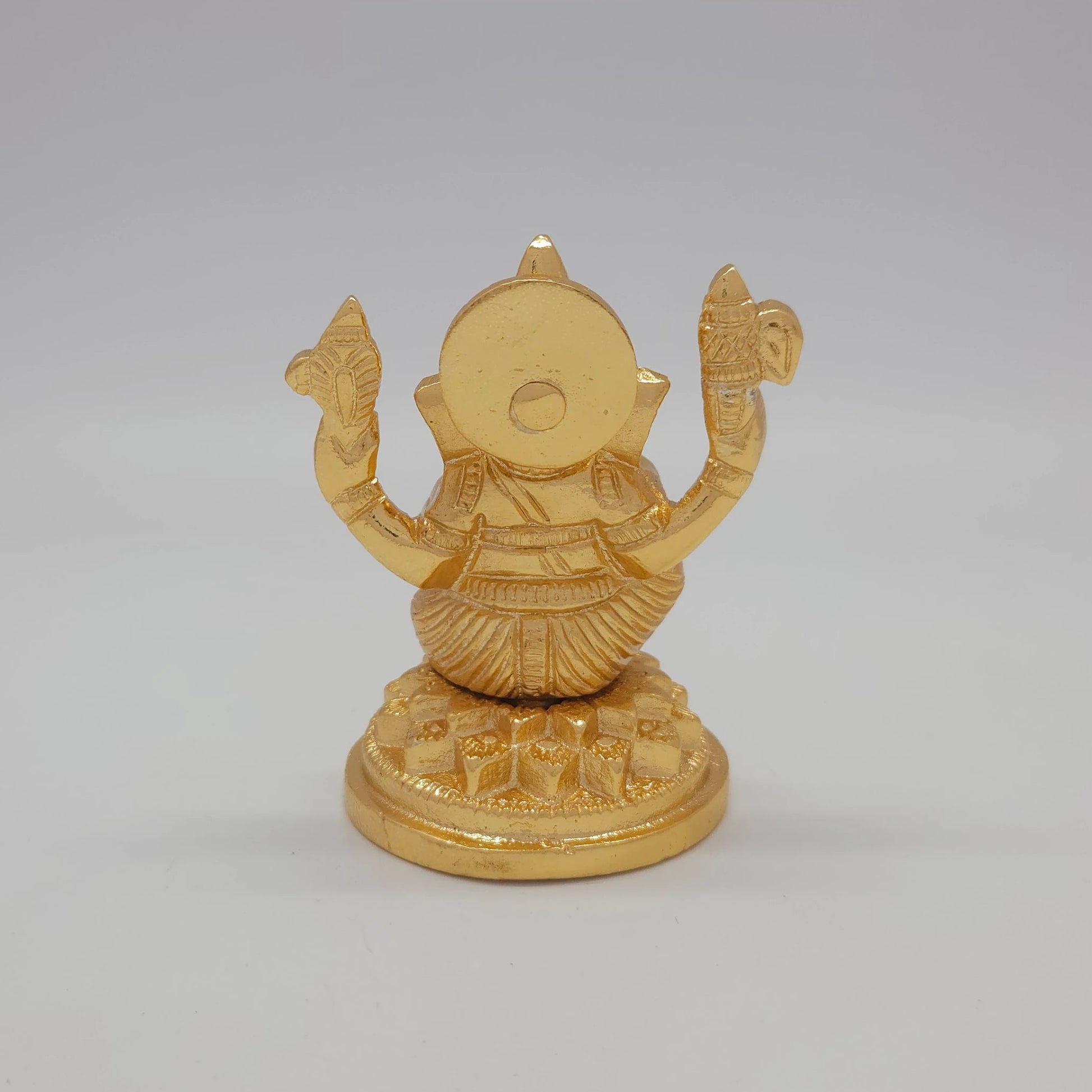Sri Swaminathan and Co brass miniature Petal Series Ganesha statue gold finish 250g weight back pose full rear view showing reverse of detailed crown and circular base plate