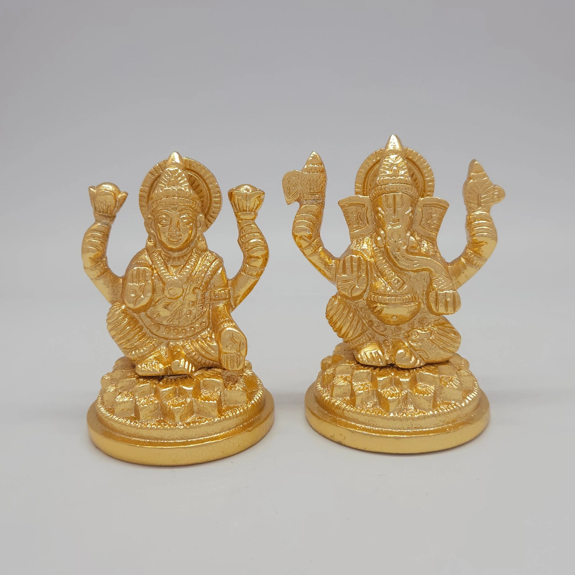 Sri Swaminathan and Co premium brass seated Petal Series Ganesha and Mahalakshmi statue circular petal base gold finish 250g weight front straight view