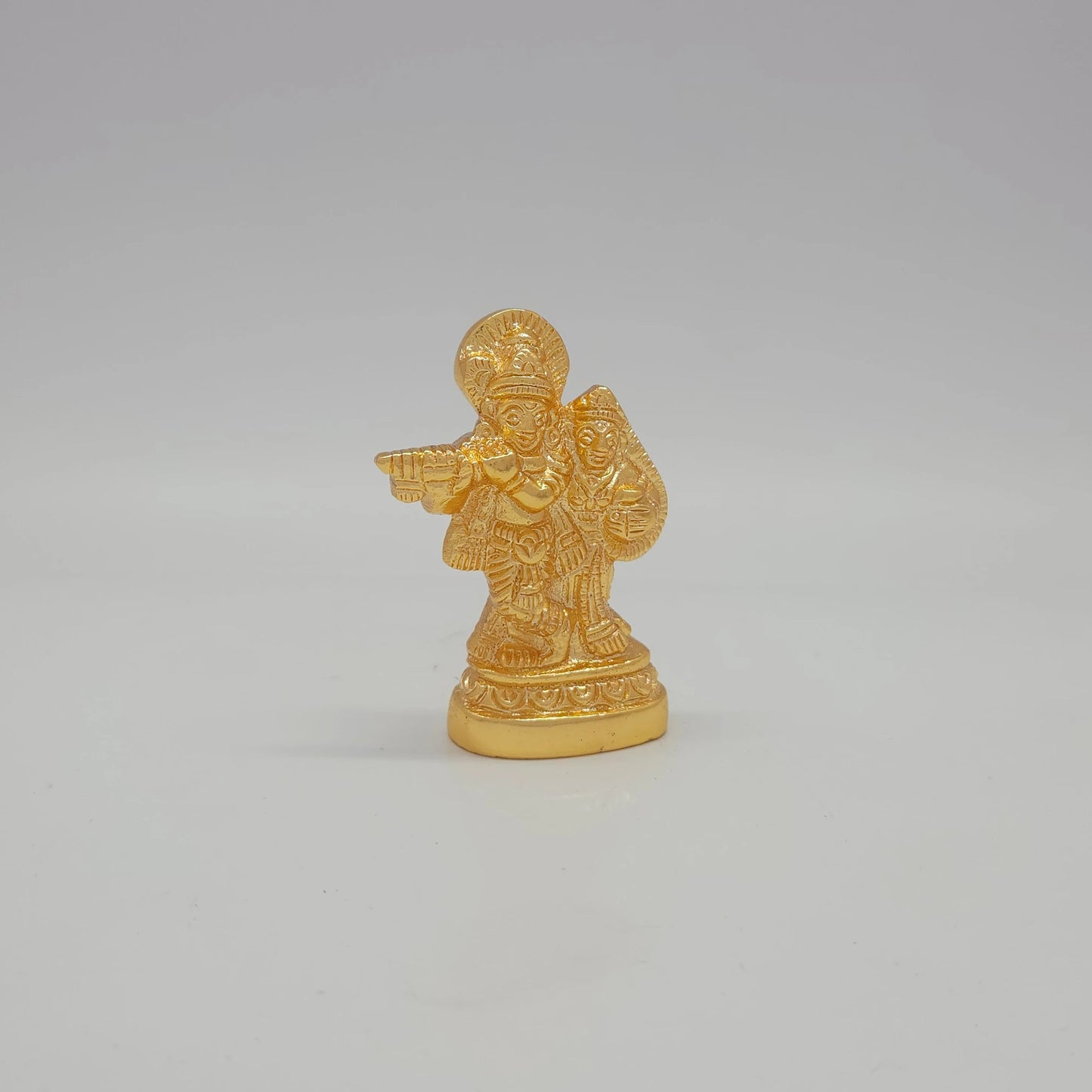 Sri Swaminathan and Co brass miniature Radha Krishna showpiece gold finish 80g weight 45 degree right pose corner view focusing on Goddess Radha profile and base depth
