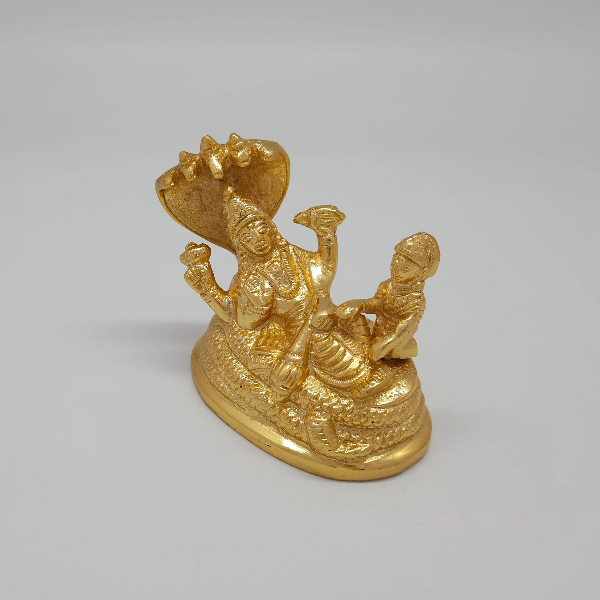 Sri Swaminathan and Co brass Perumal ranganatha statue gold finish 10cm length ariel view showing uniform satin gold powder coated layer and 5.5cm base depth