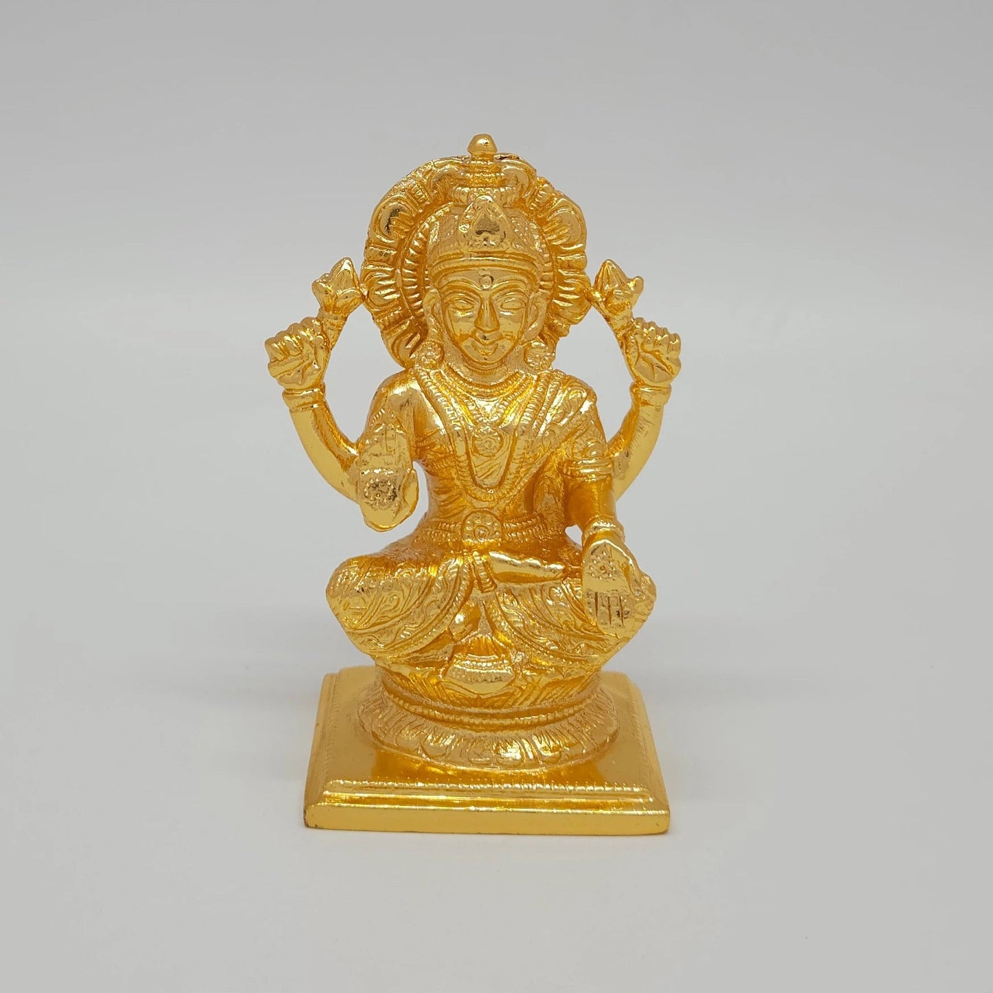 Sri Swaminathan and Co premium brass seated Goddess Lakshmi statue with lotus gold powder coated finish 4 inch 11cm height front straight profile view