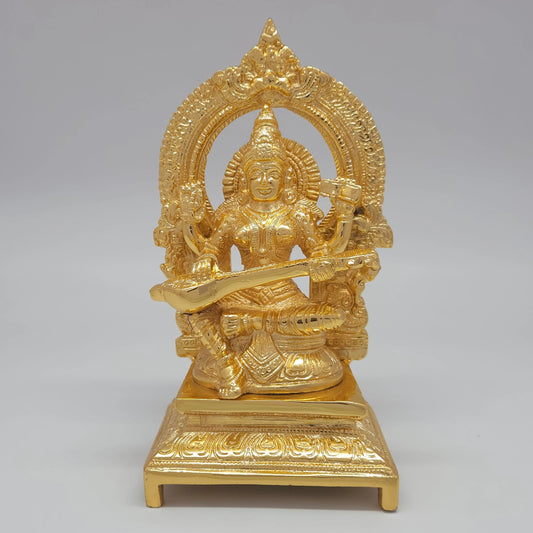 Sri Swaminathan and Co premium brass seated Goddess Sharada Saraswathi statue veena thiruvatchi arch gold powder coated finish for gifting and decor purpose