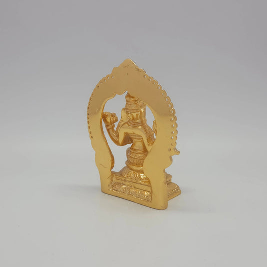 Sri Swaminathan and Co brass miniature Sharada Saraswathi statue gold finish 250g weight back pose 45-degree rear view showing reverse of flat thiruvatchi temple arch frame and rectangular pedestal