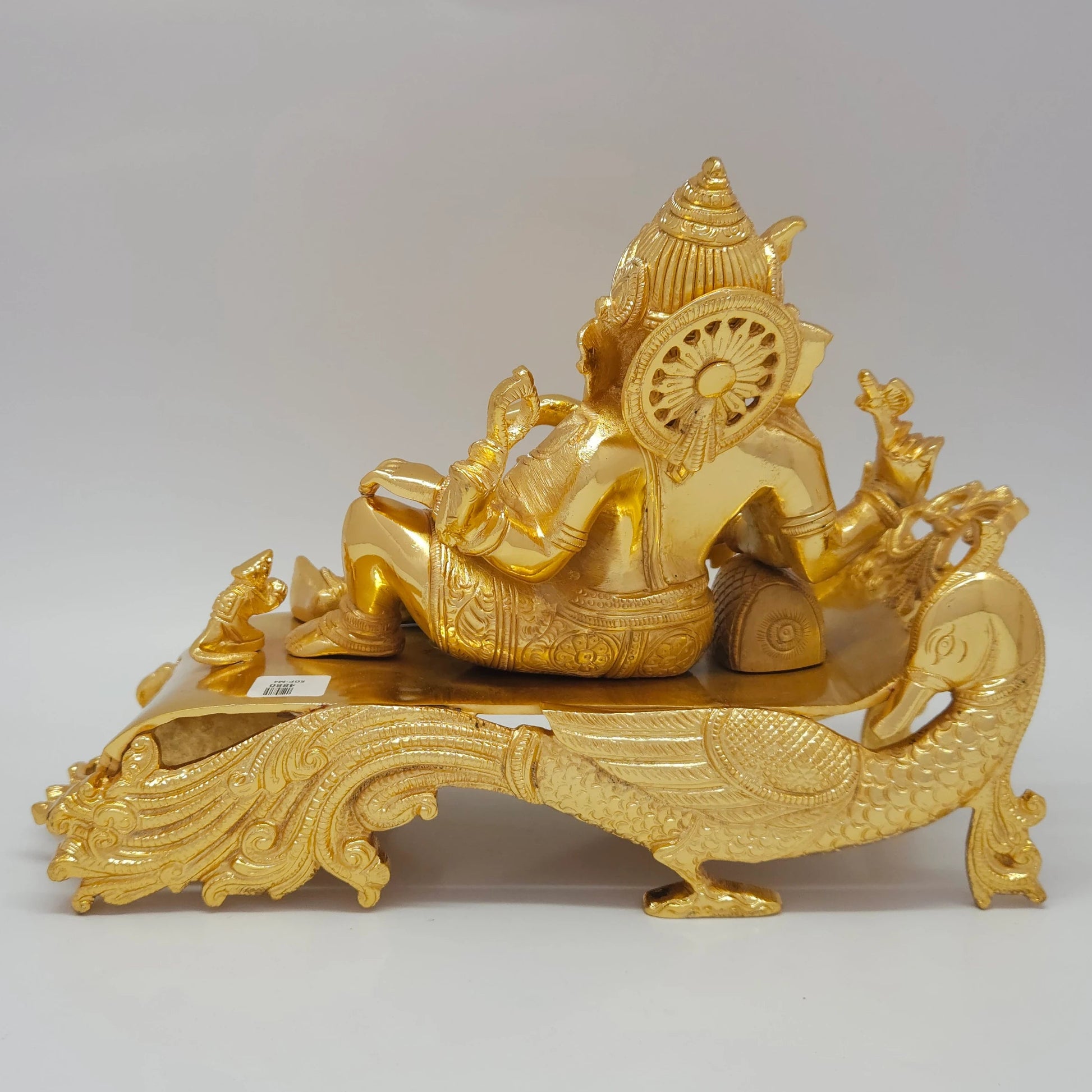 Sri Swaminathan and Co brass reclining Shayana Vinayaka statue gold finish 3.9kg weight back pose full rear view showing reverse of carved peacock plumage couch headboard