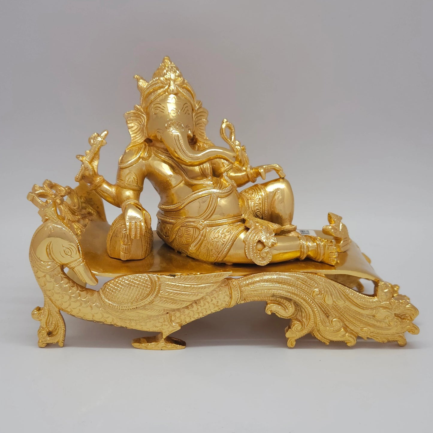 Sri Swaminathan and Co premium brass reclining Shayana Vinayaka statue on ornate peacock royal couch base gold powder coated finish 3.9kg weight front view size guide