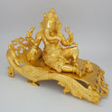 Sri Swaminathan and Co brass reclining Shayana Vinayaka statue gold finish 3.9kg weight 45 degree left pose corner view highlighting the chiseled peacock neck and bolster cushion details