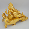 Sri Swaminathan and Co brass reclining Shayana Vinayaka statue gold finish 3.9kg weight 45 degree right pose corner view focusing on front trunk curve toward palm and right side scrollwork depth