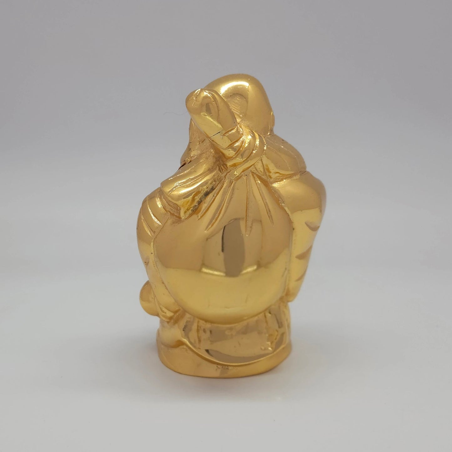 Sri Swaminathan and Co brass standing Laughing Buddha showpiece gold finish 1kg weight back pose full rear view showing reverse of draped robe and wealth sack outlines