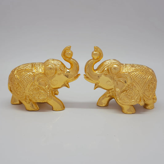 Sri Swaminathan and Co premium brass walking royal elephant statue with upraised trunk gold powder coated finish 4 inch 11cm height front straight mirror view