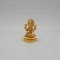 Sri Swaminathan and Co small gold finish Lakshmi statue 110g weight 45 degree left pose corner view highlighting the upper lotus buds and downward flaring petal trim profiles