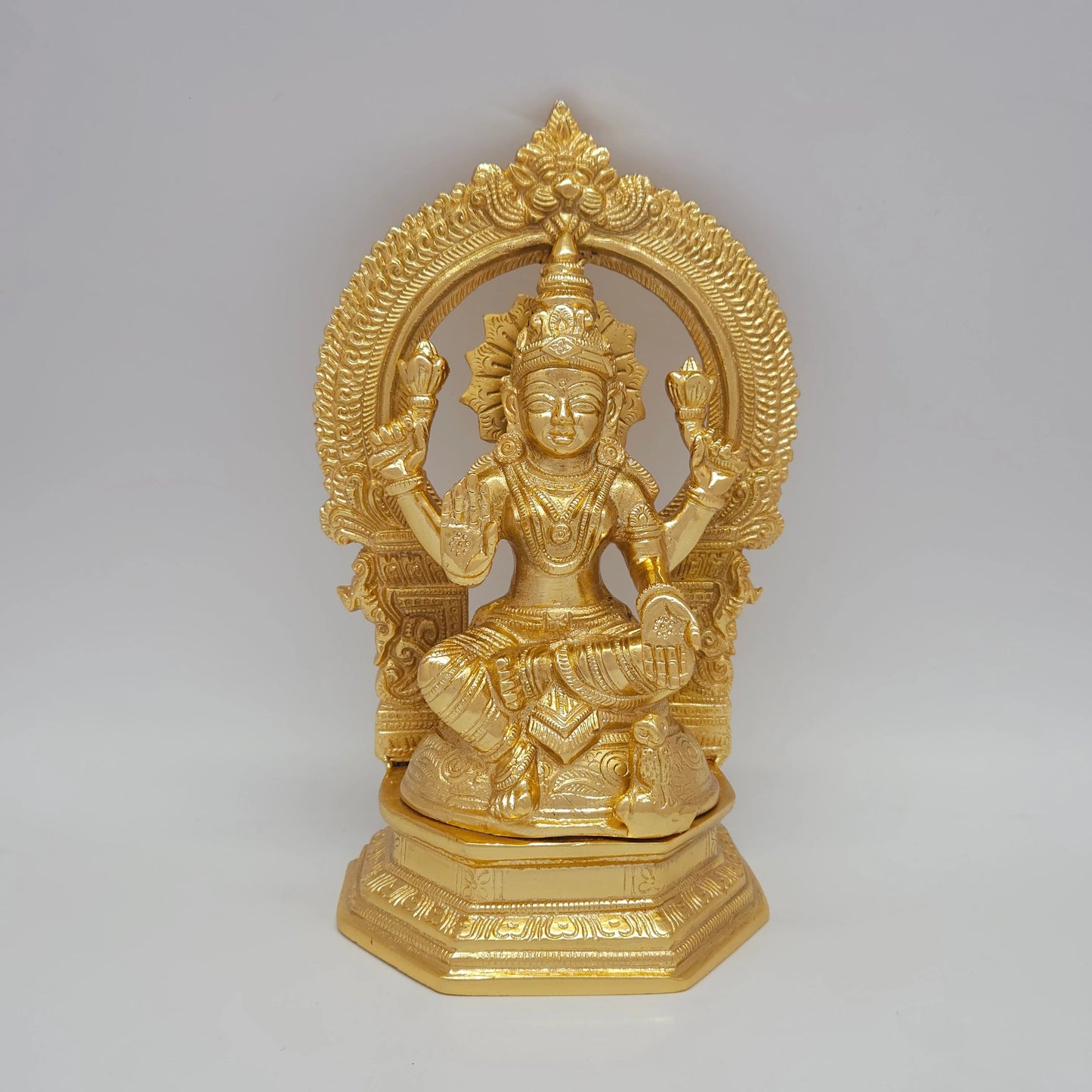 Sri Swaminathan and Co premium brass cross-legged Padmasana Lakshmi statue twin lotus ornate prabhavali thiruvatchi arch gold glossy finish front view variant