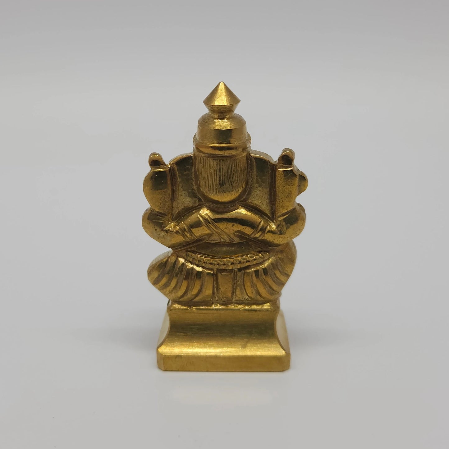 Sri Swaminathan and Co solid brass miniature Ganesha statue gold finish back pose rear view showing reverse of the crown and square base