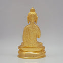 Rear view detailing the extensive scrollwork robe patterns and uniform gold sheen of the 1.35kg decorative sculpture.
