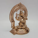 Three-quarter front perspective angle view of the five-metal Ganesha statue showing the physical thickness of the base pedestal and the side profile of the dynamic crown.