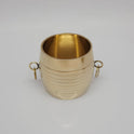 Three-quarter tilted perspective view of a single traditional brass changazhi grain measure cup focusing on the smooth open rim compartment.

