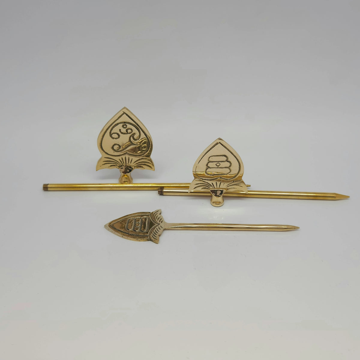 Parallel view of pure brass handheld Murugan Vels without stand highlighting the solid metallic frame and polished golden finish.