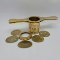 Disassembled pure brass murukku achu showing heavy double cylinder handle press and 5 interchangeable jali plates.