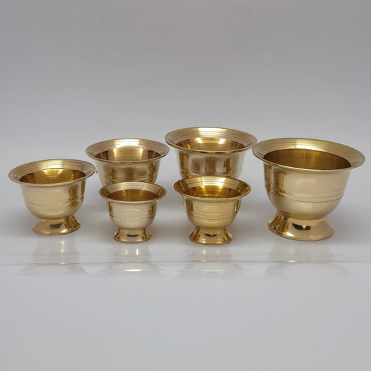 Group showcase display of premium pure brass chandan vattil and chandan katori bowls in six different sizes with pedestal stands