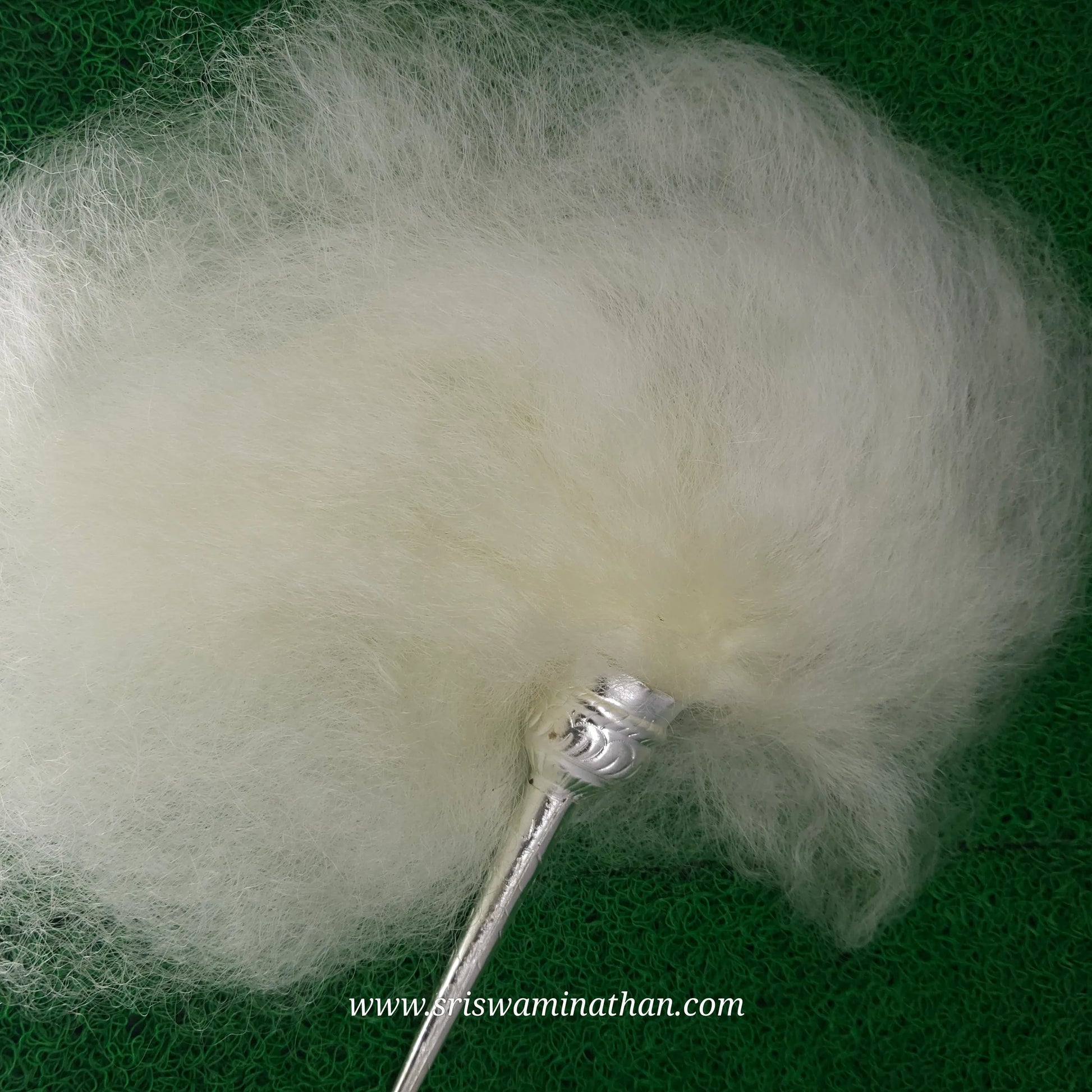 White yak-tail chowrie (vensamaram) used for divine seva and rituals.