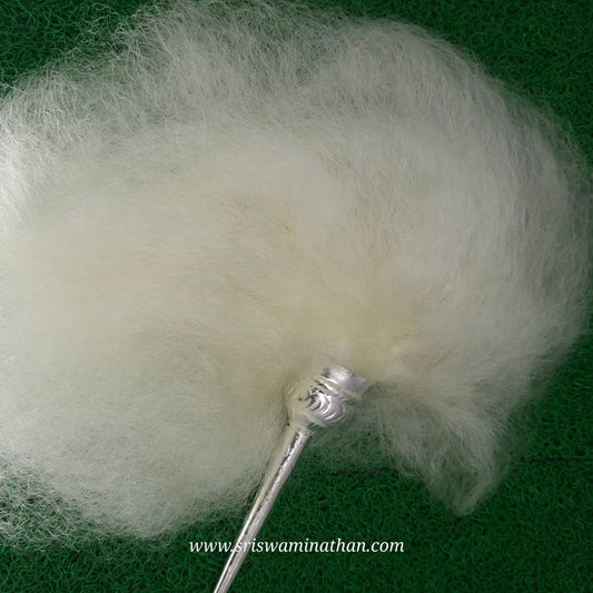 White yak-tail chowrie (vensamaram) used for divine seva and rituals.